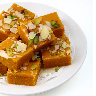 https://cdn.shopify.com/s/files/1/1857/6931/files/Dadu_s-MoongDalBurfi.jpg?v=1716903766